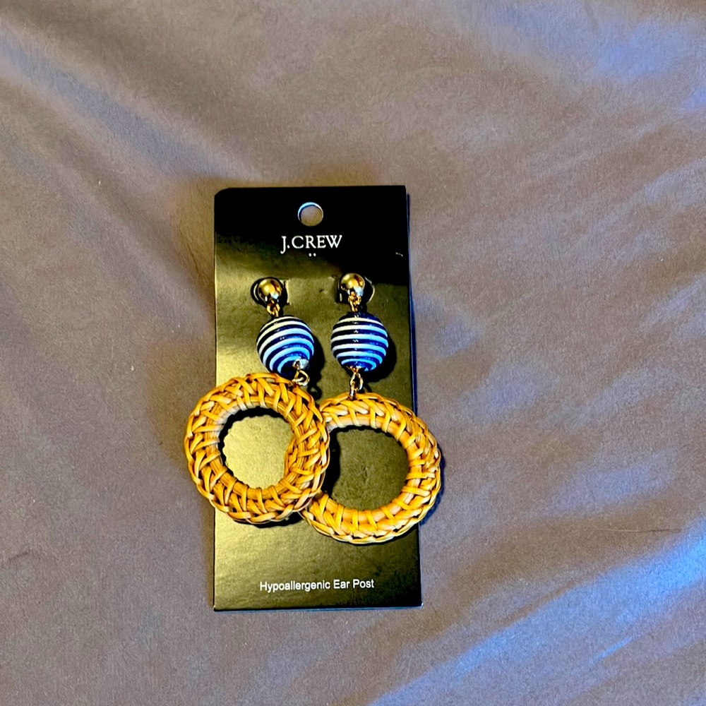 Brand new J Crew earring. Raffia hoop with navy and white round detail.